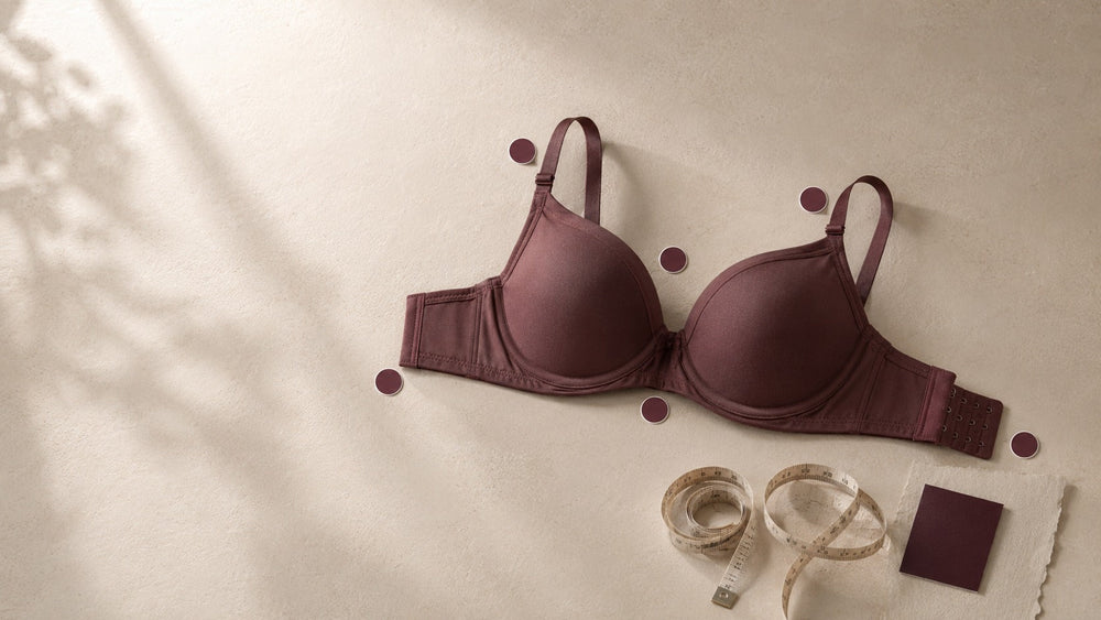 Premium flat-lay of a bra with seven visual fit checkpoints for ELORVESSA’s bra-fit article.